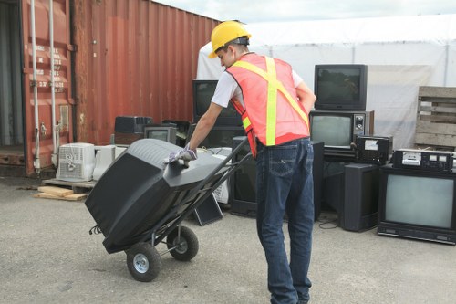 Professional waste removal truck in action